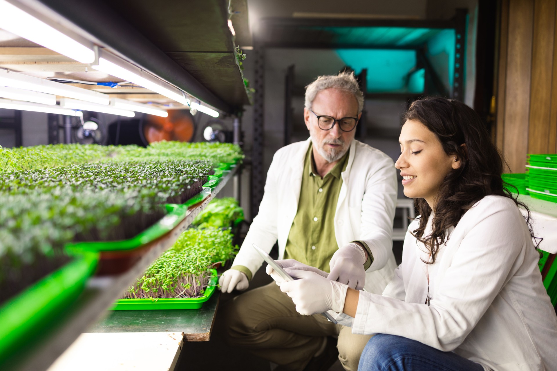 Young scientist and her colleague are working on a new discovery